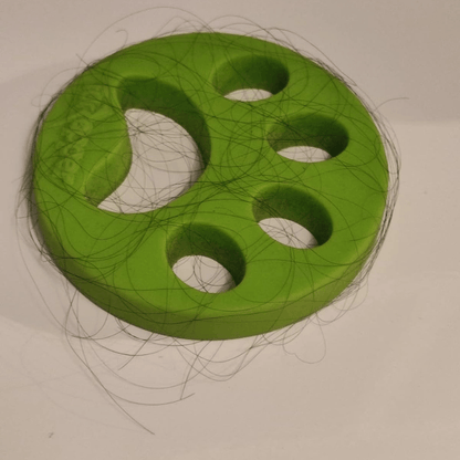 Laundry Catchers grabbing pet hair inside a washing machine drum